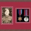 Dark woodgrain picture frame for two military medals/photo with beaujolais mount