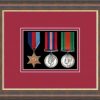 Mahogany picture frame for three military medals with beaujolais mount