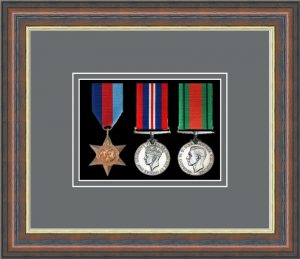 Mahogany picture frame for three military medals with grey mount