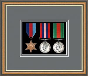 Walnut picture frame for three military medals with grey mount