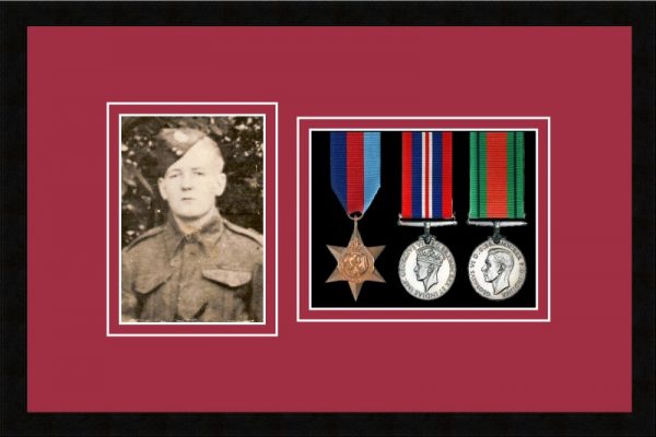 Black picture frame for three military medals/photo with beaujolais mount