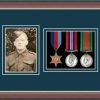 Dark walnut picture frame for three military medals /photo with nightshade mount