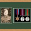 Light woodgrain picture frame for three military medals/photo with forest green mount