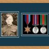 Light woodgrain picture frame for three military medals/photo with nightshade mount