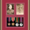 Walnut picture frame for four military medals/two photos with beaujolais mount