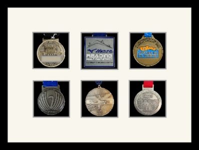 Black picture frame for six marathon medals with antique white mount