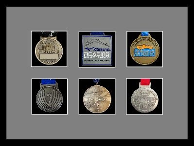 Black picture frame for six marathon medals with grey mount