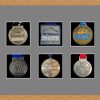 Light woodgrain picture frame for six marathon medals with grey mount