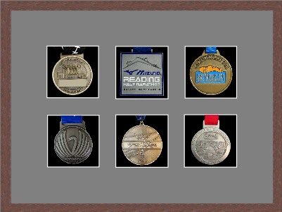 Dark woodgrain picture frame for six marathon medals with grey mount