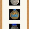 Light woodgrain picture frame for three marathon medals with antique white mount