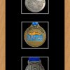 Light woodgrain picture frame for three marathon medals with black mount
