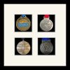 Black picture frame for four marathon medals with antique white mount