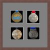 Dark woodgrain picture frame for four marathon medals with grey mount
