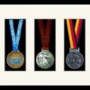 Black picture frame for three marathon medals with antique white mount