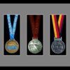 Black picture frame for three marathon medals with grey mount