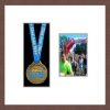 Dark woodgrain picture frame for one marathon medal/photo with antique white mount