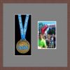 Dark woodgrain picture frame for one marathon medal/photo with grey mount
